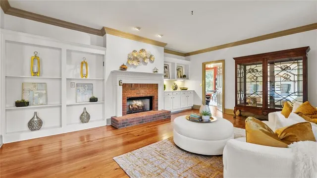 a living room with furniture rug and wooden floor