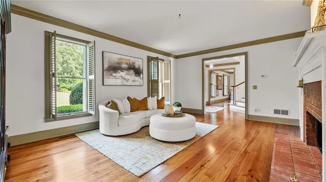 a open kitchen with stainless steel appliances granite countertop a stove and a dining table view