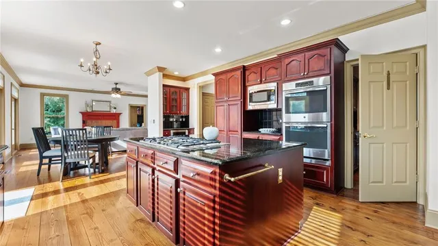 a bathroom with a tub a sink and a window