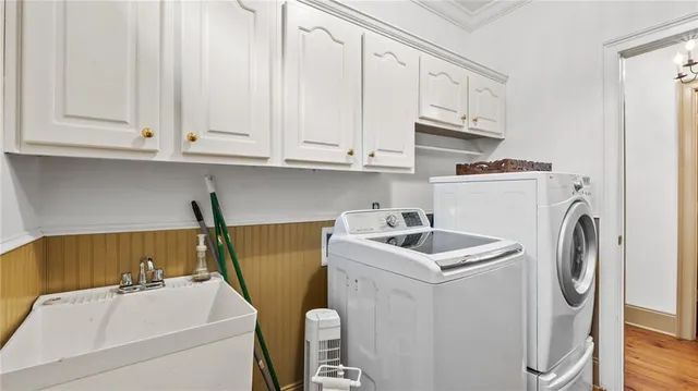 a bathroom with a toilet a sink and a mirror