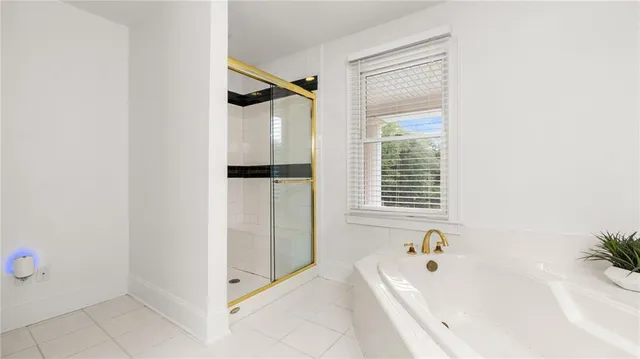 a bathroom with a toilet a sink and a mirror