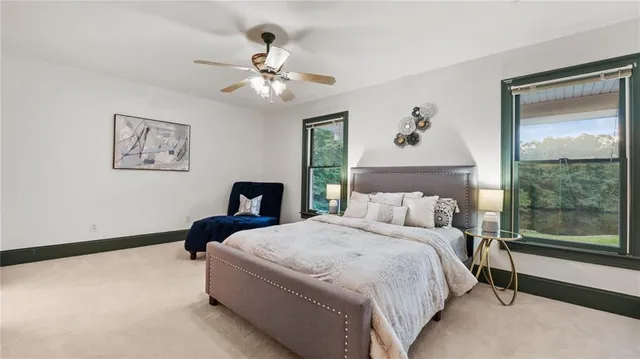 a view of a lake with a house in the background