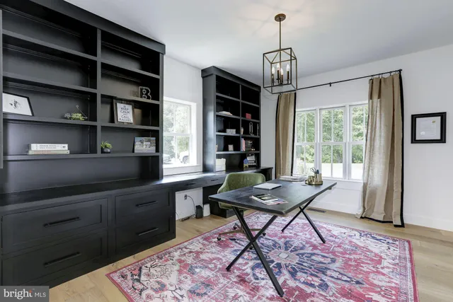 a spacious bathroom with a double vanity sink a mirror a bathtub and shower