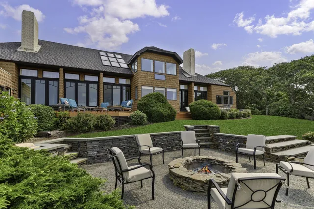 a swimming pool with trees in the background