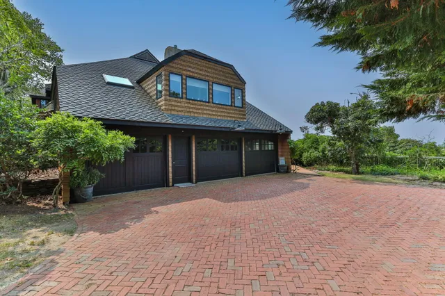 a kitchen with stainless steel appliances a stove a sink and a refrigerator