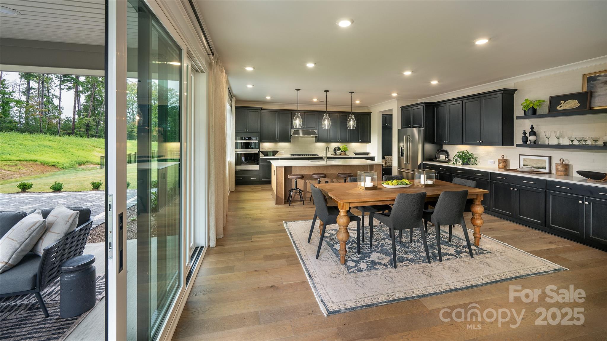 604 Hyder Trail Tega Cay, SC 29708 - Photo 11 of 44 a view of a dining area with furniture