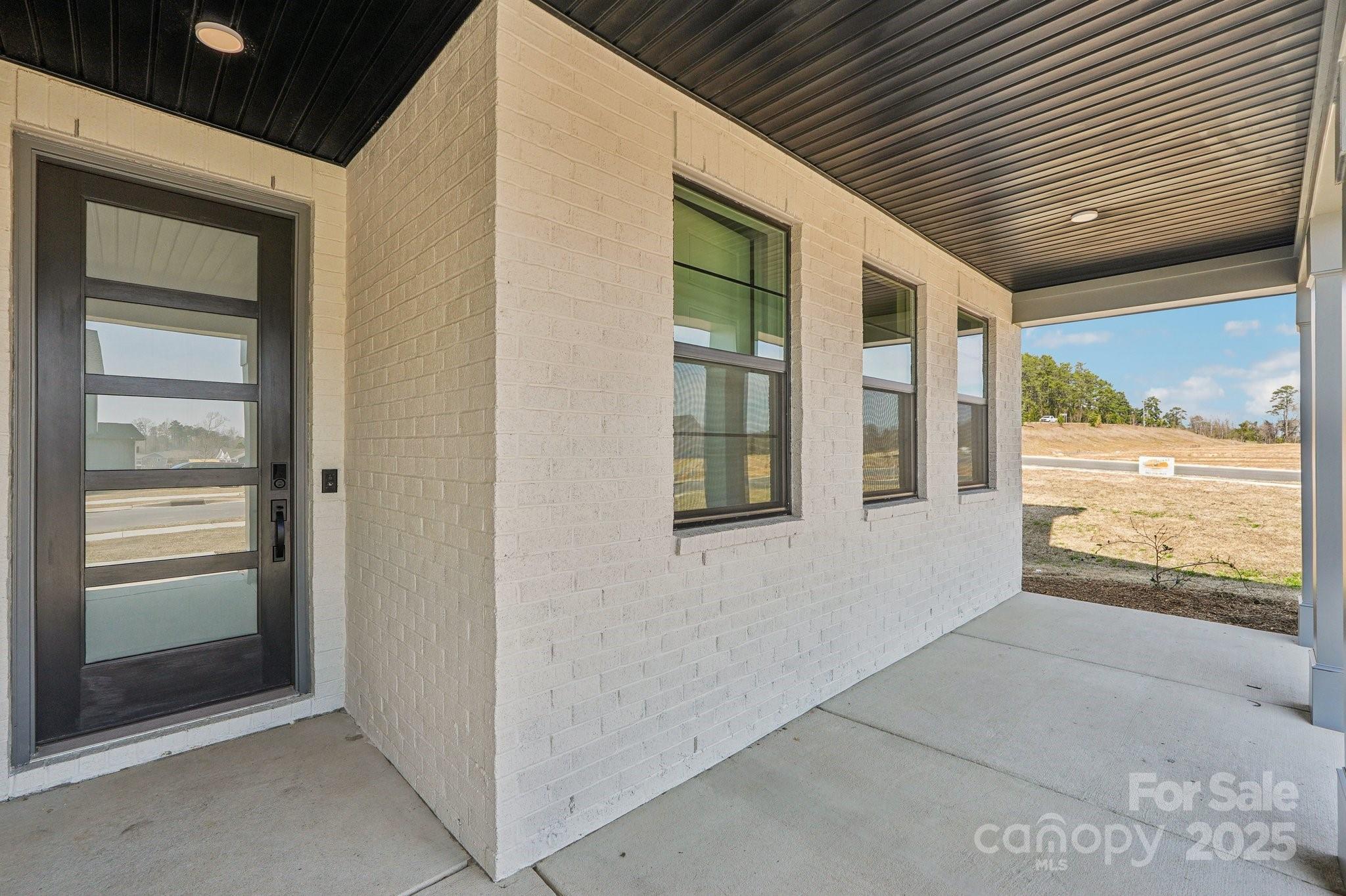 604 Hyder Trail Tega Cay, SC 29708 - Photo 2 of 44 a view of an entryway of the house