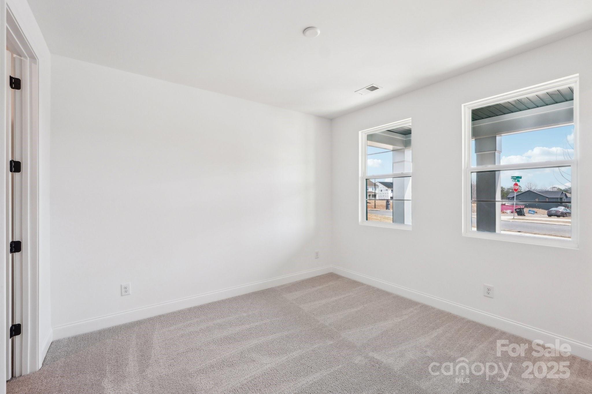 604 Hyder Trail Tega Cay, SC 29708 - Photo 22 of 44 an empty room with windows