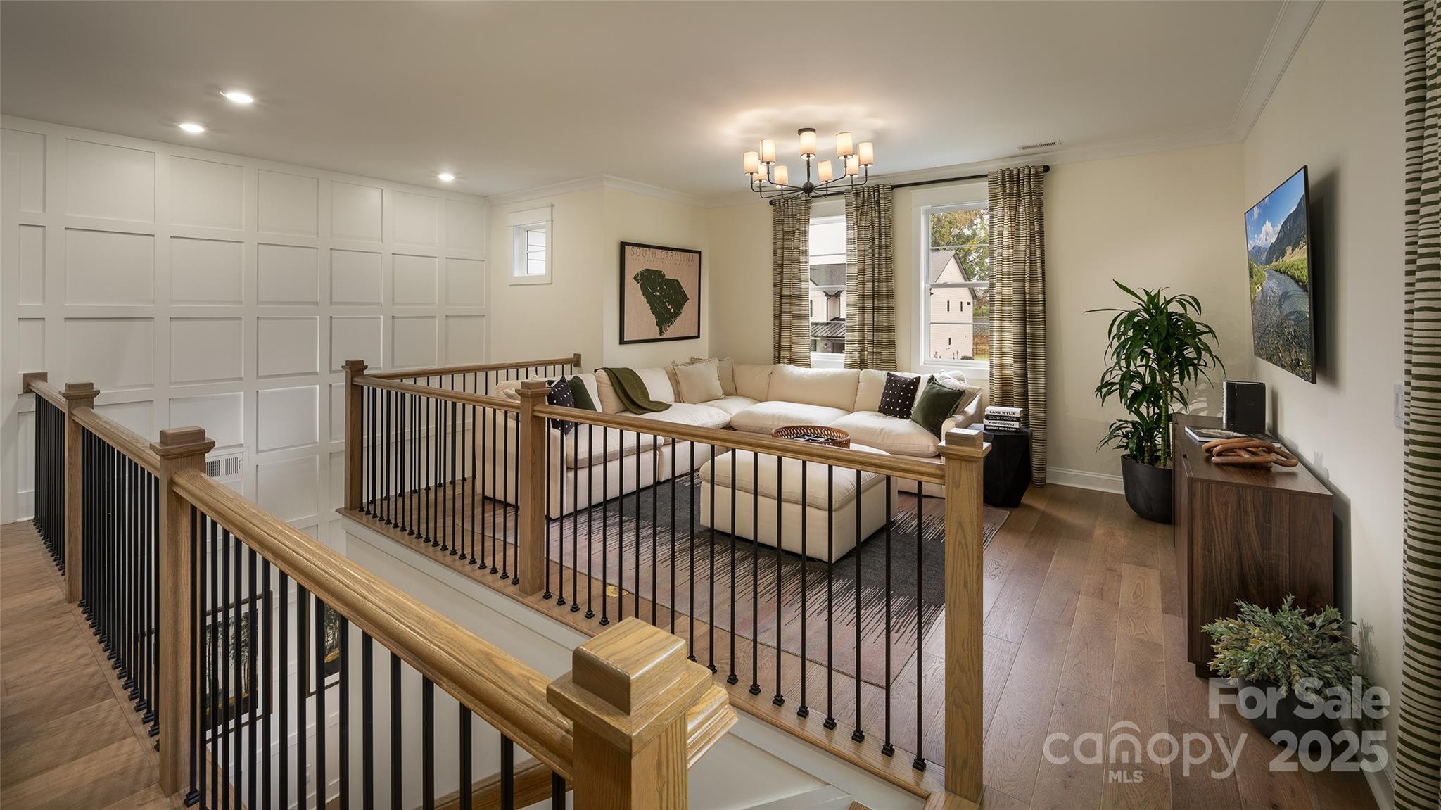 604 Hyder Trail Tega Cay, SC 29708 - Photo 25 of 44 a bedroom with furniture and a chandelier