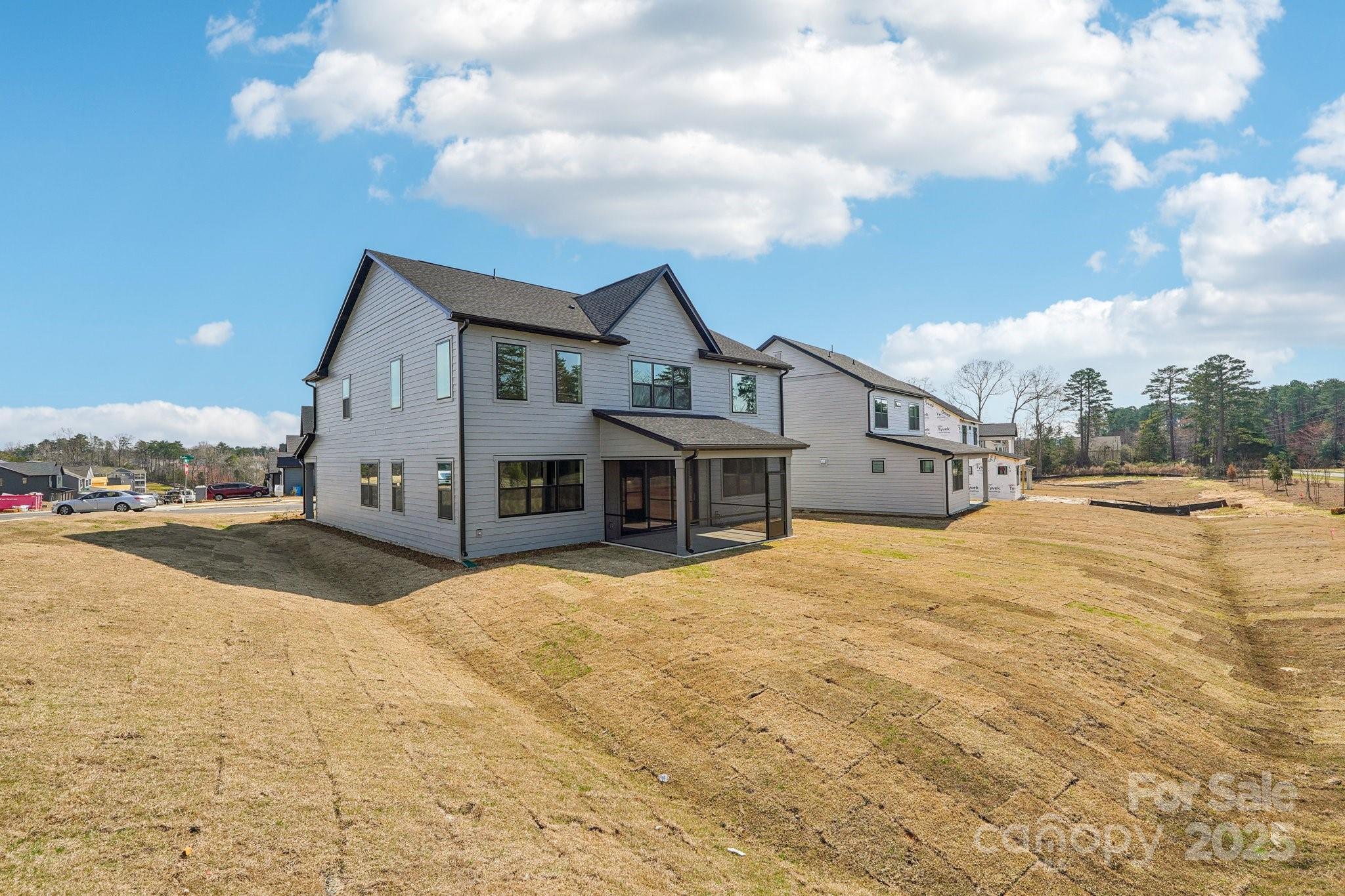 604 Hyder Trail Tega Cay, SC 29708 - Photo 39 of 44 a view of a house with a yard