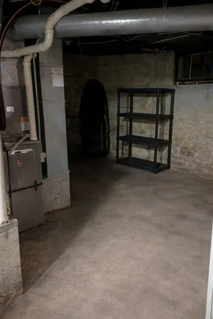 a view of an empty room with a fireplace