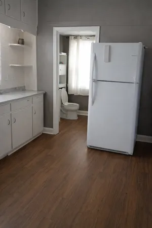 a white refrigerator freezer sitting in a kitchen
