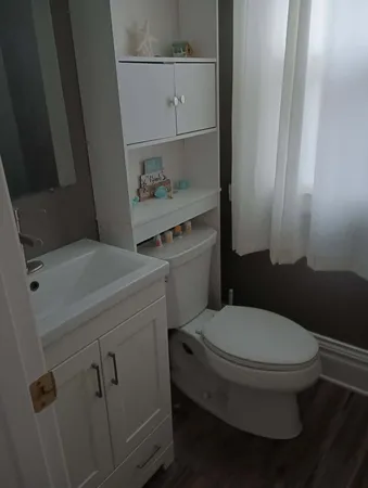 a bathroom with a toilet and a sink