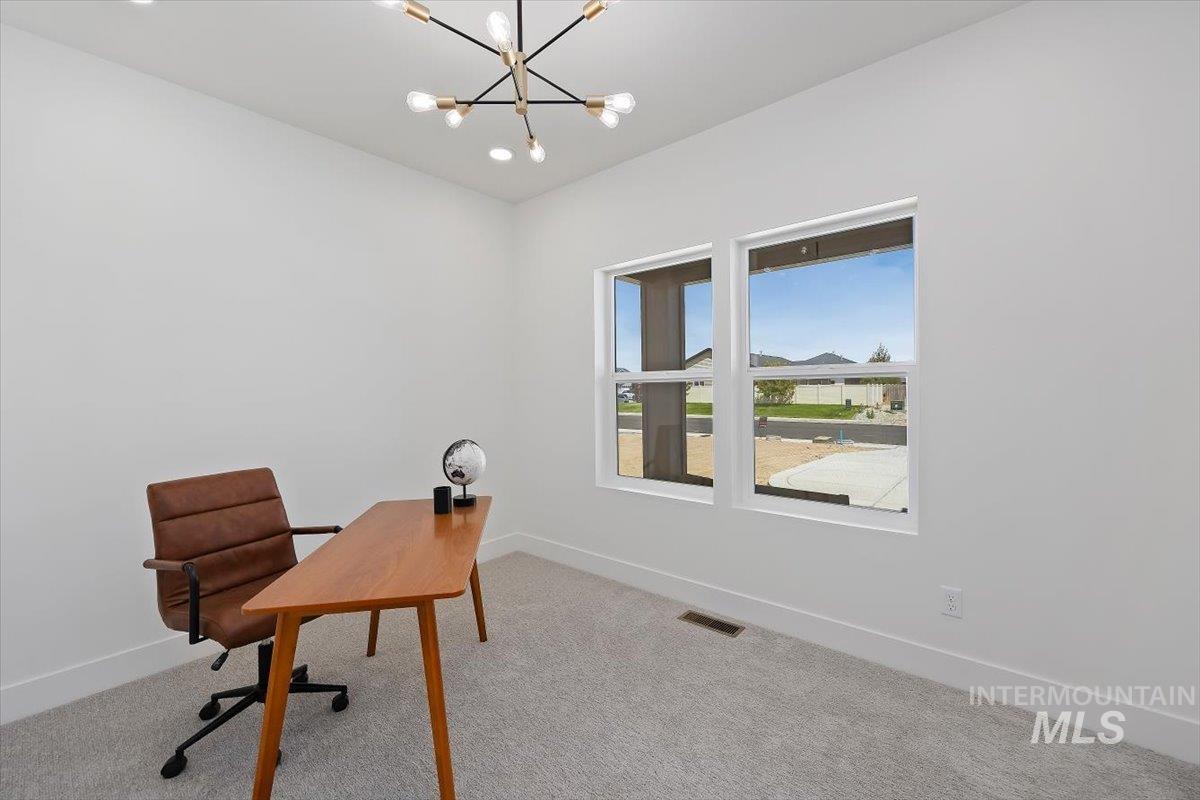 2005 Sparrow Street Rupert, ID 83350 - Photo 22 of 30 Room with light gray carpeting, crisp white walls, and dual windows