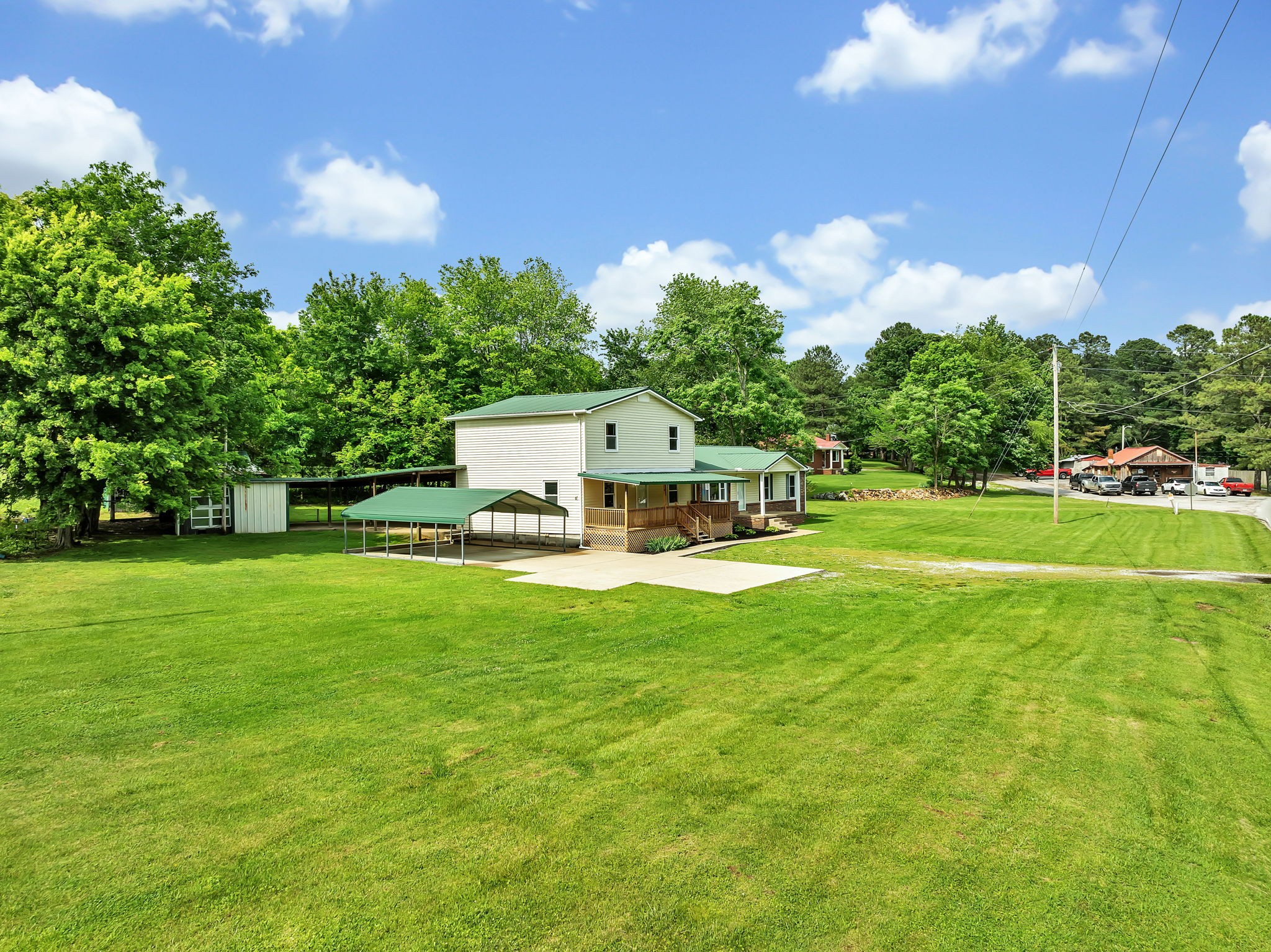 8768 Lyles Road Lyles, TN 37098 - Photo 23 of 57 a view of a house with pool and a garden