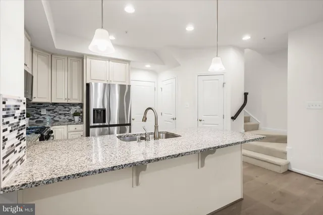 a bathroom with a double vanity sink mirror and toilet