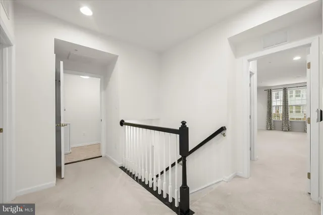 a bathroom with a sink a toilet a mirror and shower