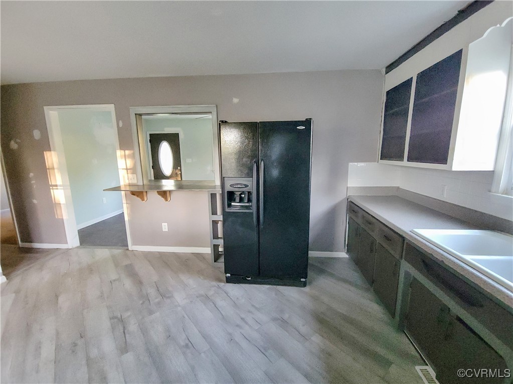 15604 Exter Mill Road Chesterfield, VA 23838 - Photo 11 of 22 a kitchen with granite countertop a refrigerator and a sink