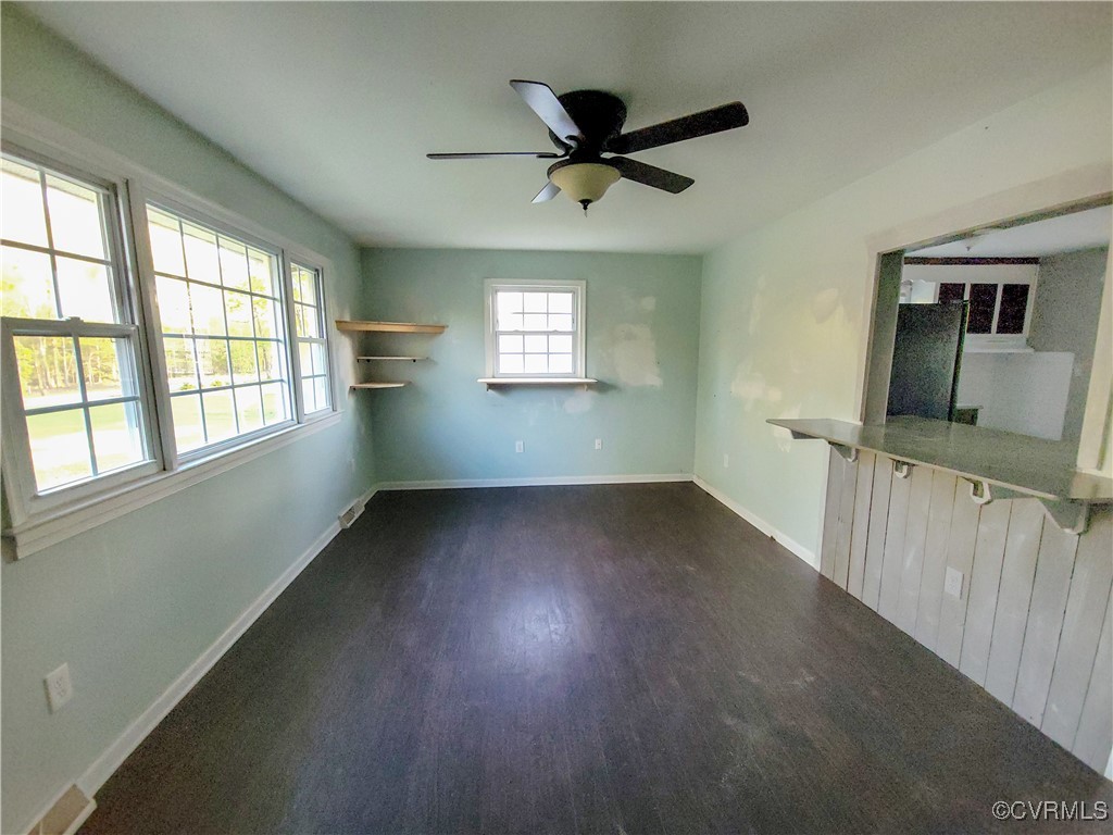 15604 Exter Mill Road Chesterfield, VA 23838 - Photo 22 of 22 an empty room with wooden floor fan and windows