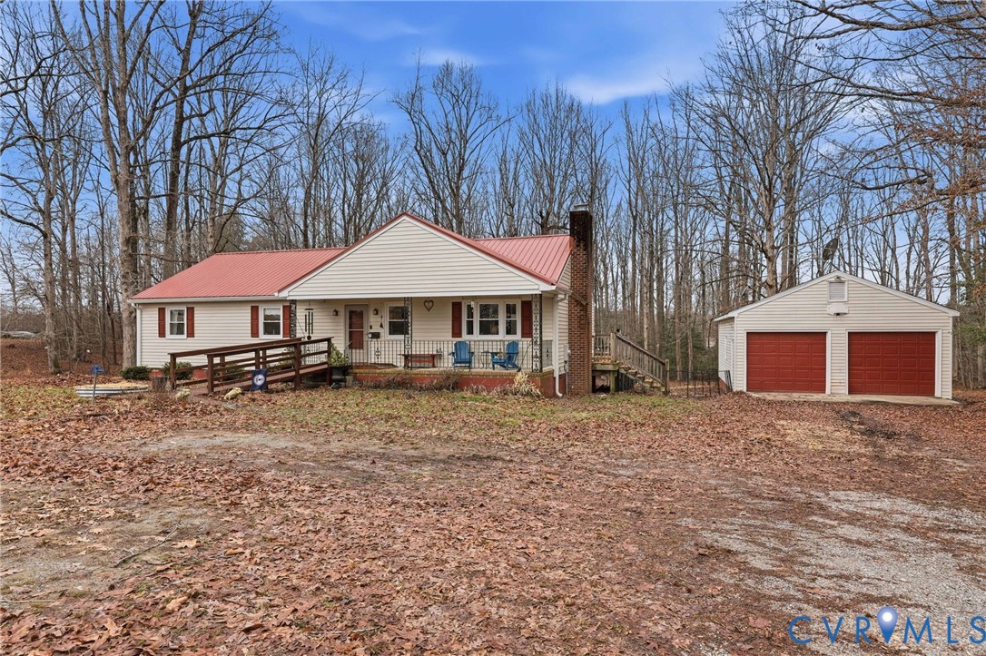 10118 White Oak Church Road Wilsons, VA 23894 - Photo 1 of 1 a front view of a house with yard and trees