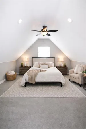 a bedroom with a bed and window