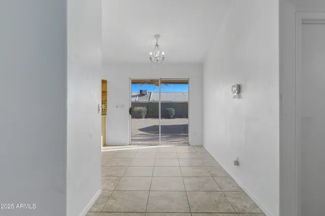 a view of a livingroom with a kitchen
