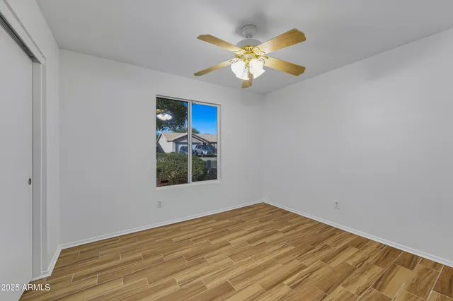 a view of a hallway with wooden shelves