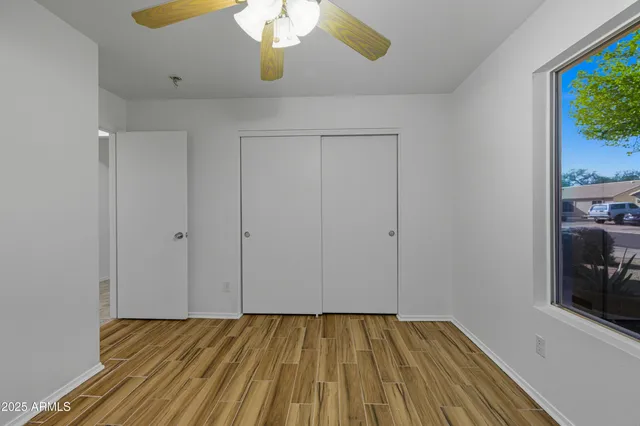 a view of an empty room with a window