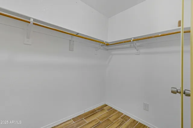 a bathroom with a granite countertop sink a toilet and a mirror