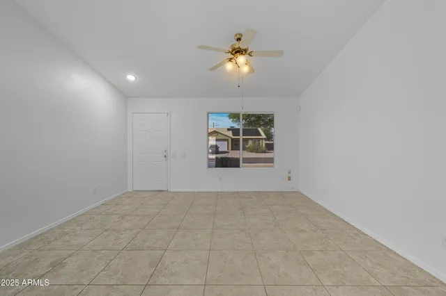 a view of a livingroom with a chandelier fan