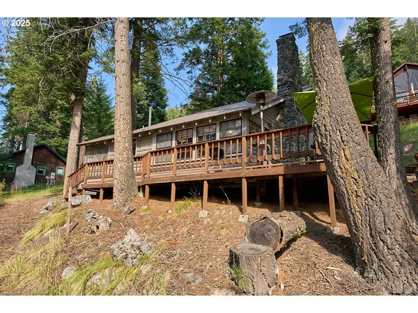 a view of a house with backyard porch and sitting area