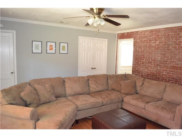 309 Glascock Street Raleigh, NC 27604 - Photo 12 of 23 a living room with furniture and a couch