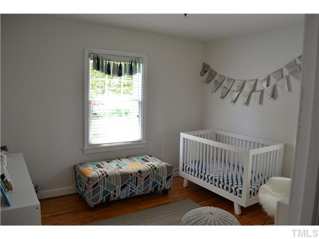 309 Glascock Street Raleigh, NC 27604 - Photo 15 of 23 a bedroom with a bed and a window