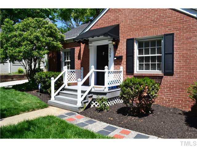309 Glascock Street Raleigh, NC 27604 - Photo 3 of 23 a view of a house with potted plants and a bench