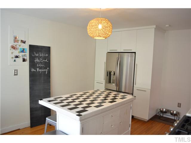 309 Glascock Street Raleigh, NC 27604 - Photo 10 of 23 a kitchen with stainless steel appliances granite countertop a stove a refrigerator and a microwave