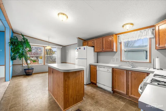 a kitchen with cabinets a sink and a stove