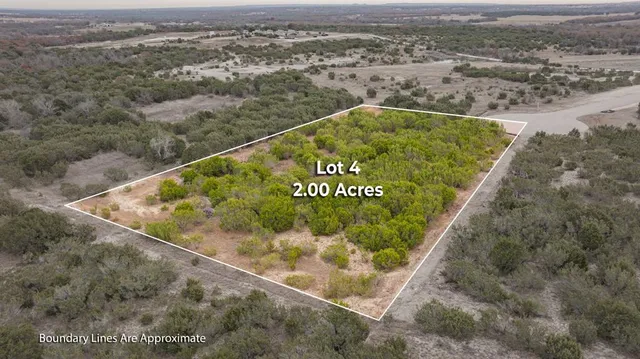 a view of a field with an ocean view