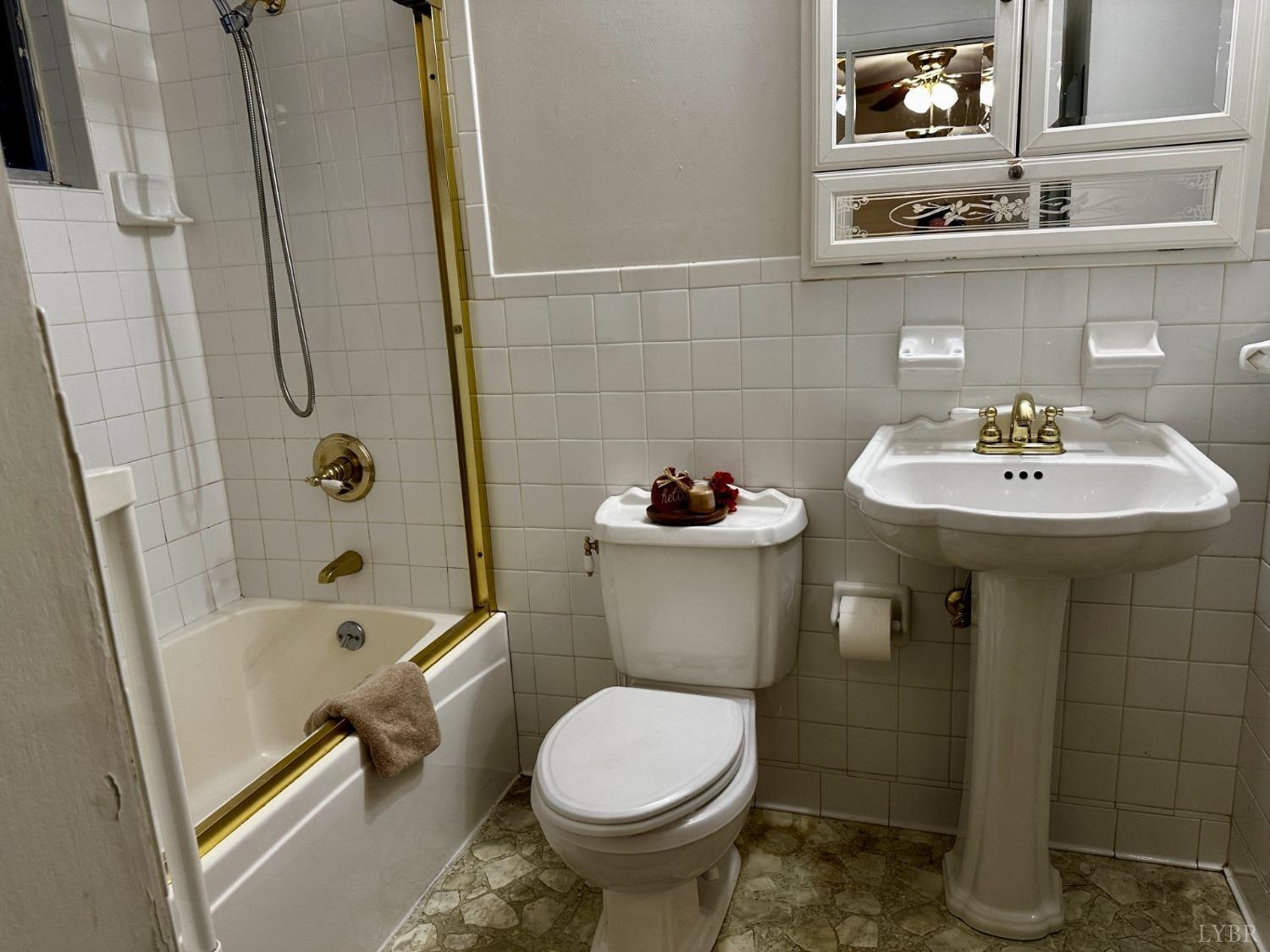 32 Pine Drive Lynchburg, VA 24502 - Photo 21 of 30 a bathroom with a sink toilet and shower
