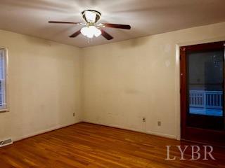 32 Pine Drive Lynchburg, VA 24502 - Photo 4 of 30 a view of a room with wooden floor and a ceiling fan