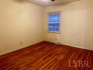 32 Pine Drive Lynchburg, VA 24502 - Photo 10 of 30 an empty room with wooden floor and windows