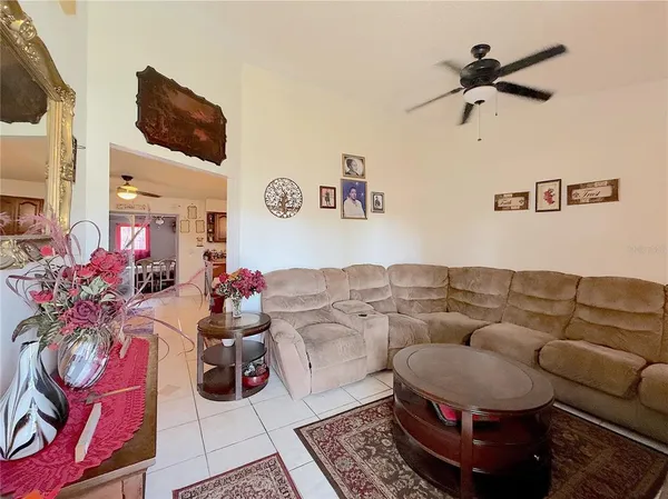 a living room with furniture and a rug