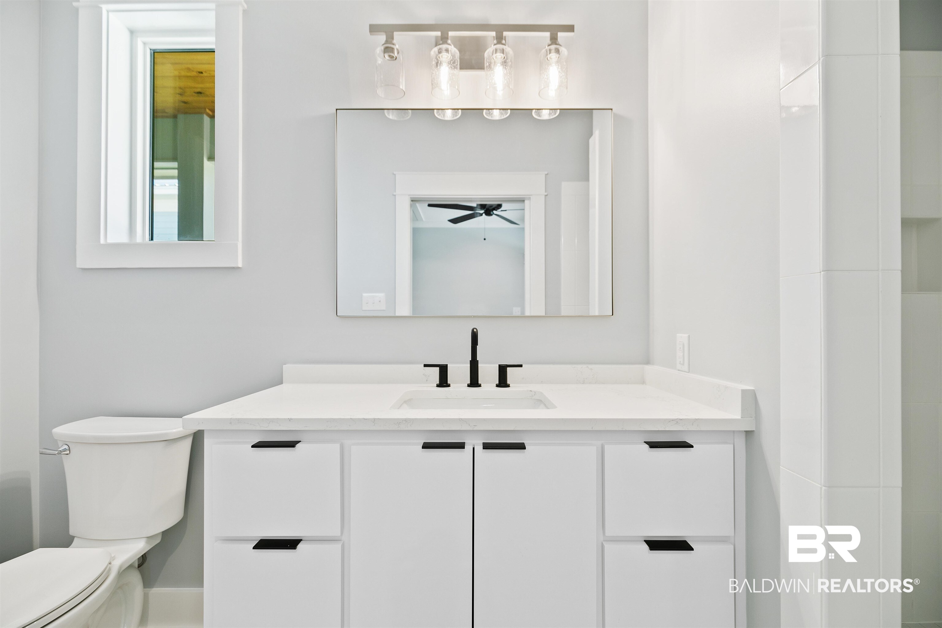 10507 County Road 1 Fairhope, AL 36532 - Photo 24 of 59 Bathroom with vanity, ceiling fan, and toilet