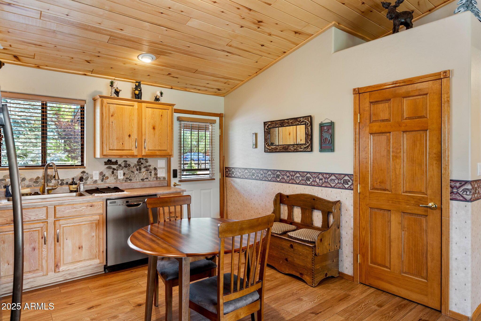 2344 Buffalo Loop Overgaard, AZ 85933 - Photo 12 of 30 a view of a dining room with furniture and wooden floor