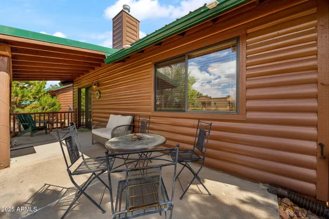 a view of a chairs and table in the patio
