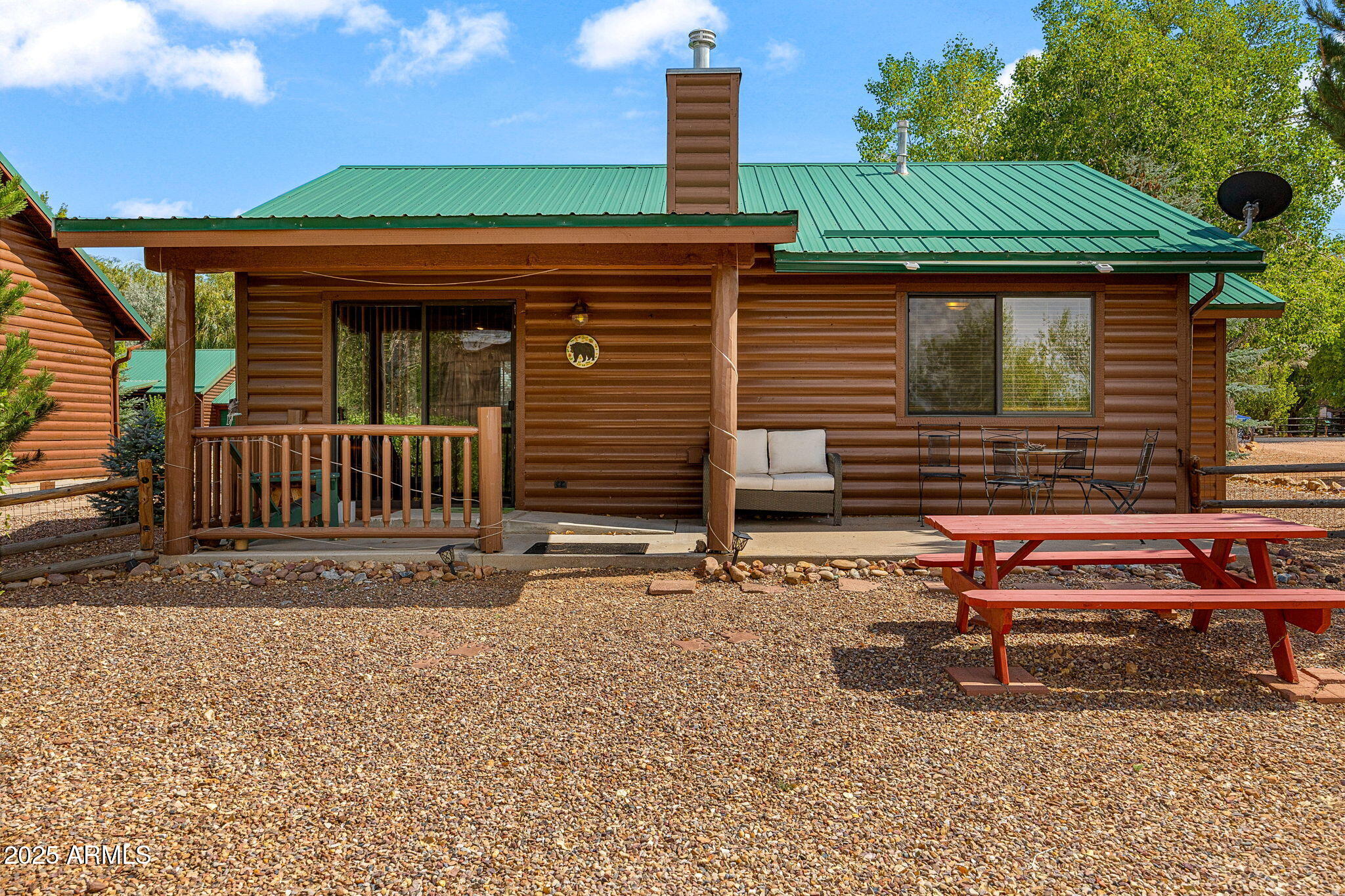 2344 Buffalo Loop Overgaard, AZ 85933 - Photo 20 of 30 a backyard of a house with barbeque oven table and chairs