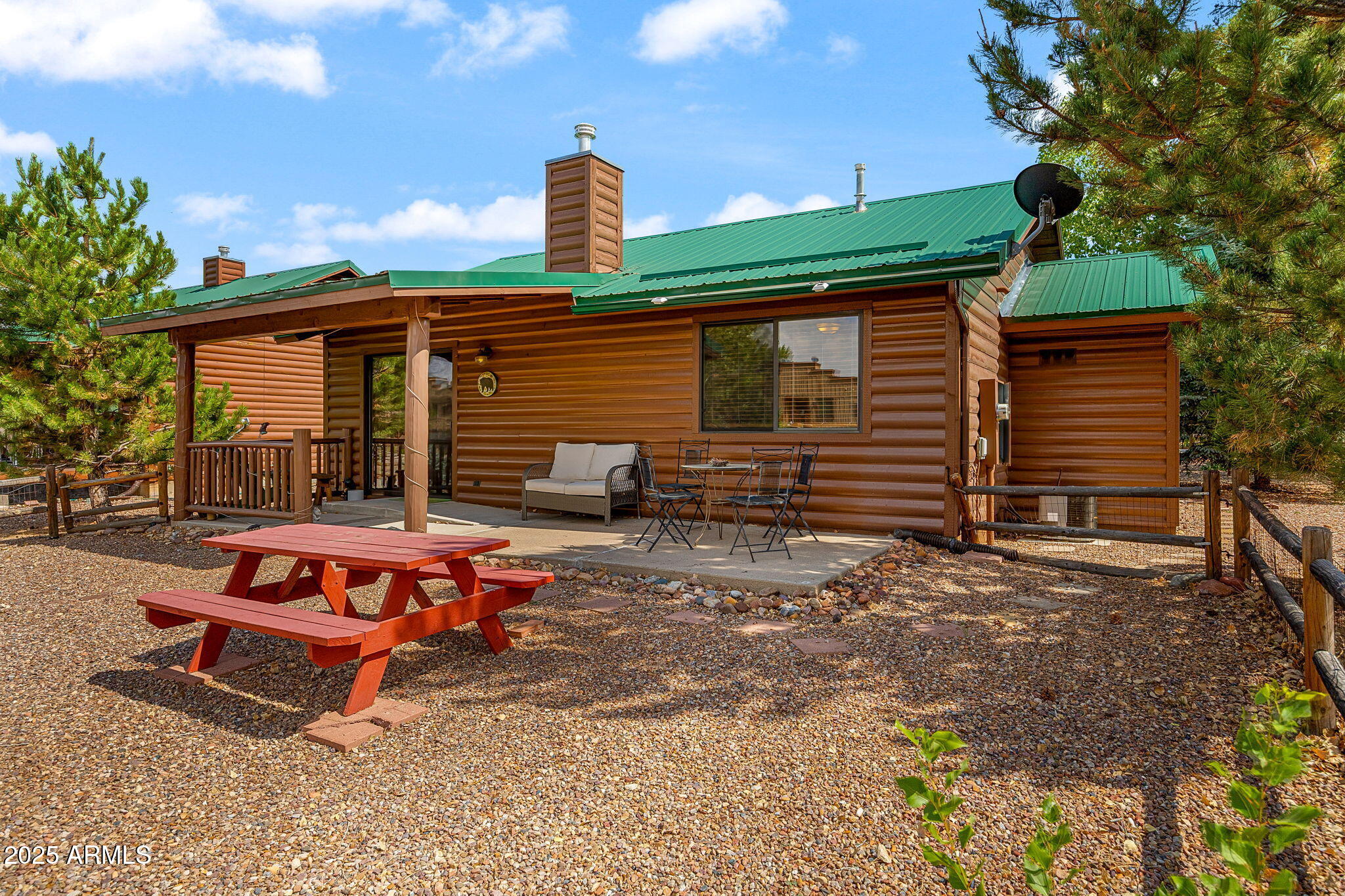 2344 Buffalo Loop Overgaard, AZ 85933 - Photo 21 of 30 a backyard of a house with barbeque oven table and chairs