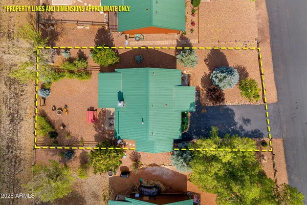 an aerial view of a house with a lake view