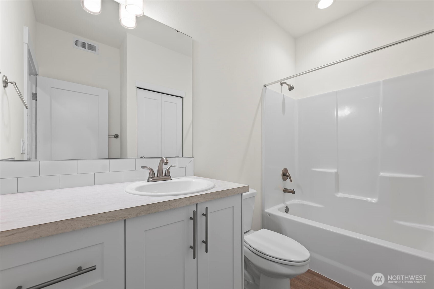 19013 Highway 3, Unit AB Allyn, WA 98524 - Photo 15 of 36 a bathroom with a sink a toilet and shower