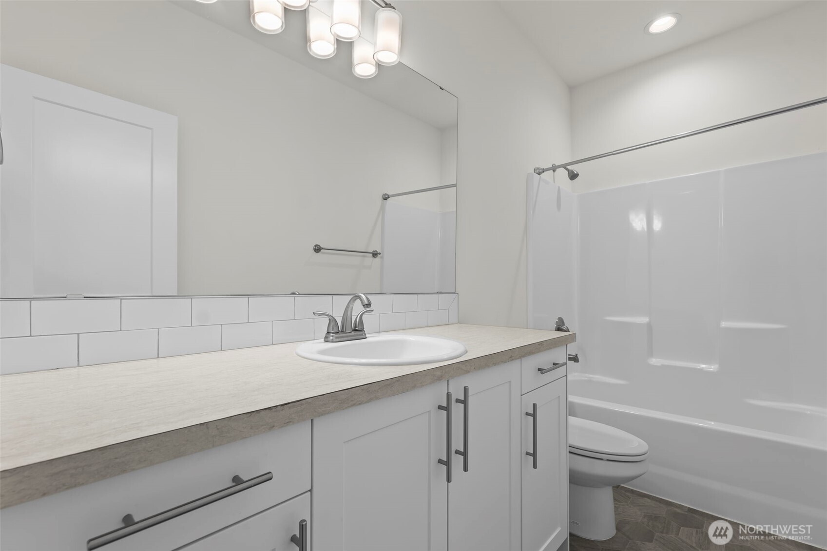 19013 Highway 3, Unit AB Allyn, WA 98524 - Photo 35 of 36 a bathroom with a sink a toilet a tub and shower