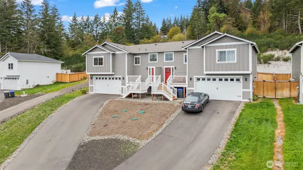 a view of a car park in front of a house